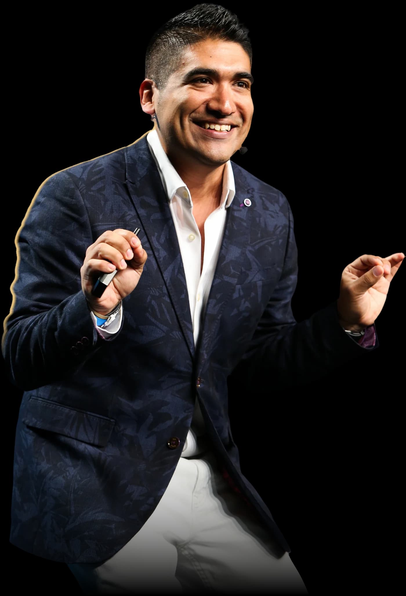 Miguel Carrasco speaking on stage
