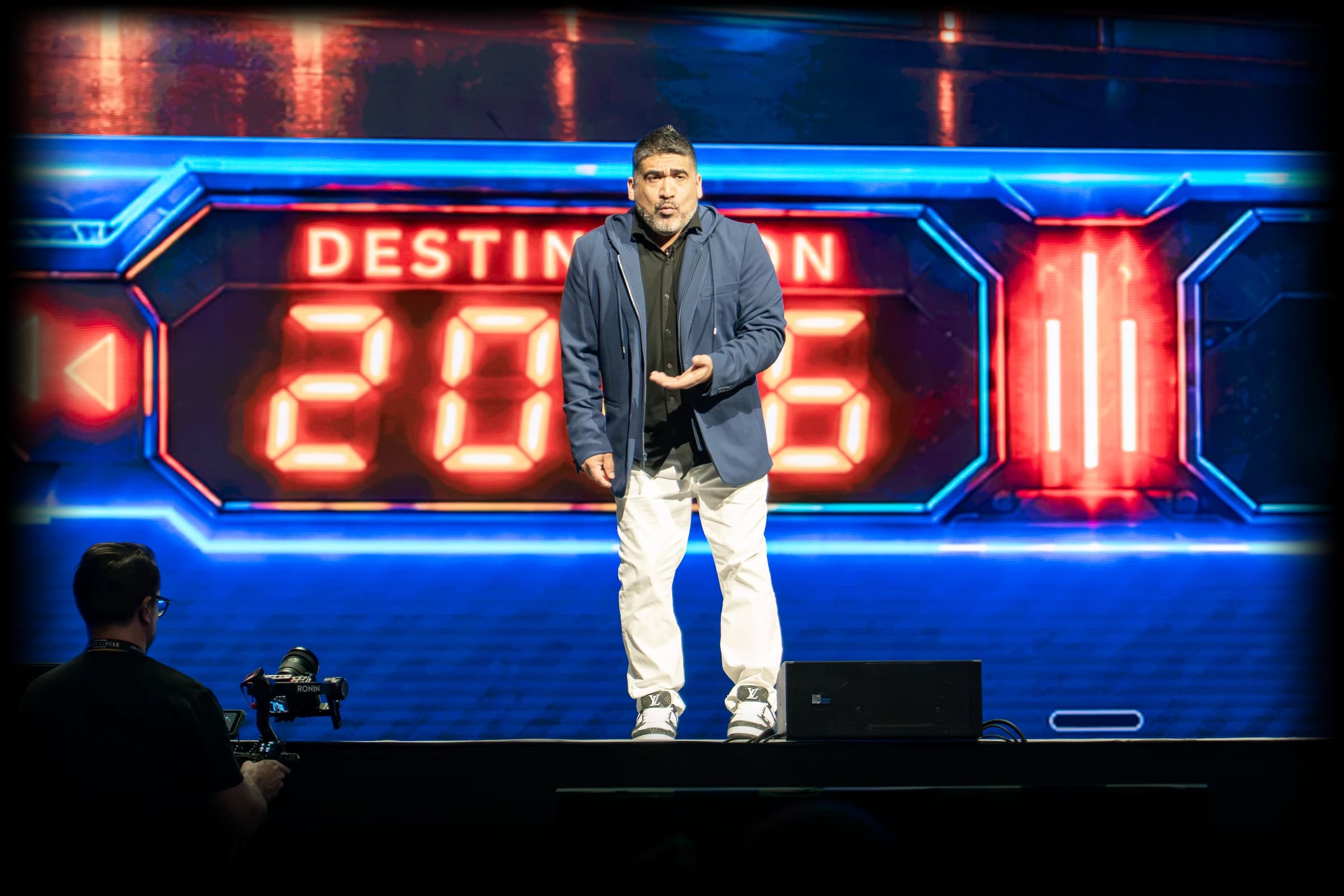 Miguel Carrasco on the Funnel Hacking Live 2026 stage, screens reading 2026 and 2050 behind him